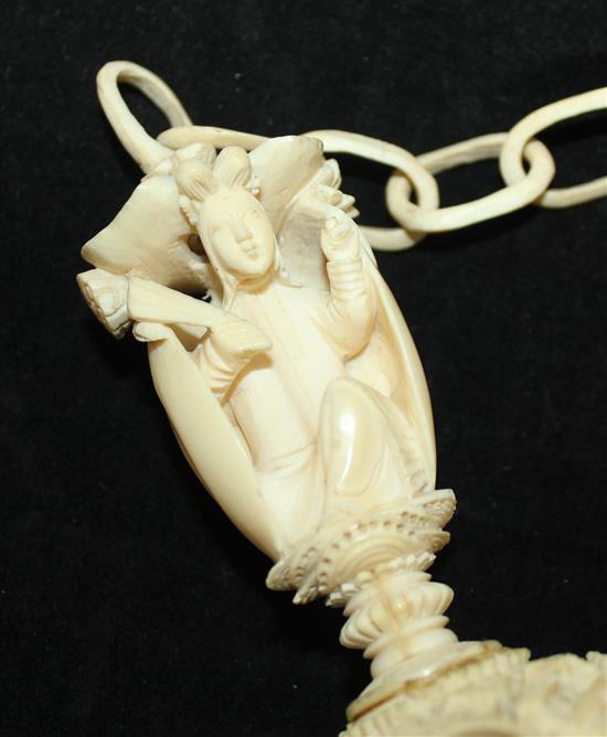 A Chinese export ivory hanging puzzle ball, 19th century, 34cm incl. chain